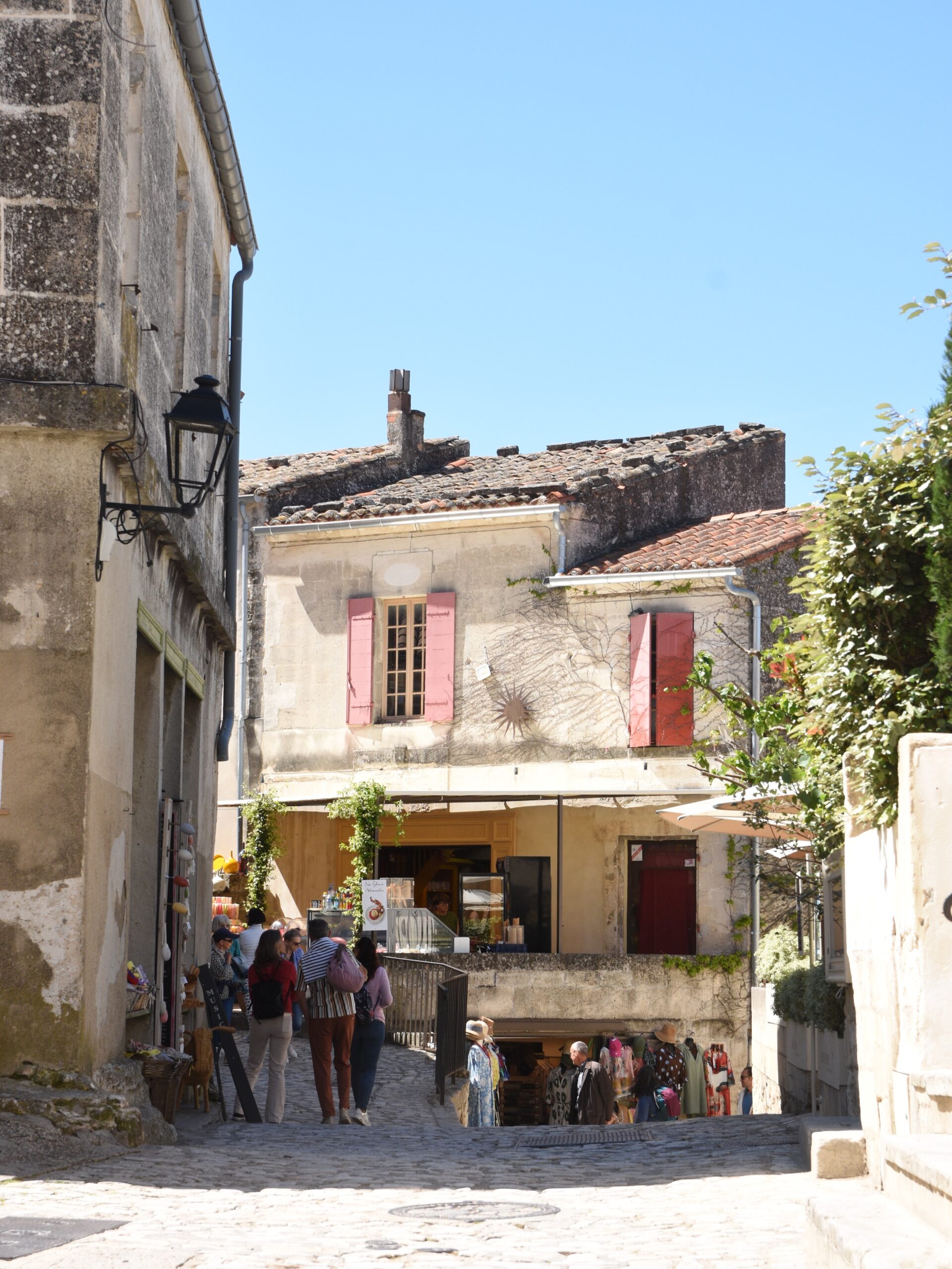 5-Day Provence Itinerary — Day 3
We started the day in Saint-Rémy-de-Provence with a simple breakfast from a local boulangerie, croissants and something sweet.
—
Then we drove to Les Baux-de-Provence, one of the most unique places we visited. The village is literally built on top of a rocky ridge in the Alpilles, surrounded by cliffs with amazing views. Walking through it feels very different from other towns because everything is made of stone, the houses, the walls, the streets, even the staircases. It makes sense when you remember this wasn’t designed to be a charming village, but a strategic fortress. The view from the village, offers a landscape, with olive groves, cypress trees and that very particular golden light of Provence.
—
We went back to Saint-Rémy for lunch at @bartabacdesalpilles where we had a really good meal. We also tried a local Vermentino from the Alpilles, which felt quite different from the Tuscany ones, a bit rounder, softer and more Mediterranean.
After lunch, we spent some time just walking around Saint-Rémy.
—
Later in the afternoon, we drove to Avignon. We walked around the historic center, saw the Palais des Papes and the Pont d’Avignon. It feels more monumental and historic compared to the smaller villages we had been visiting.
Dinner was at @arlequin_restaurant in Avignon, a younger and more modern spot with traditional dishes but with a twist.
—
We ended the day driving back to Saint-Rémy, ready for the next one.